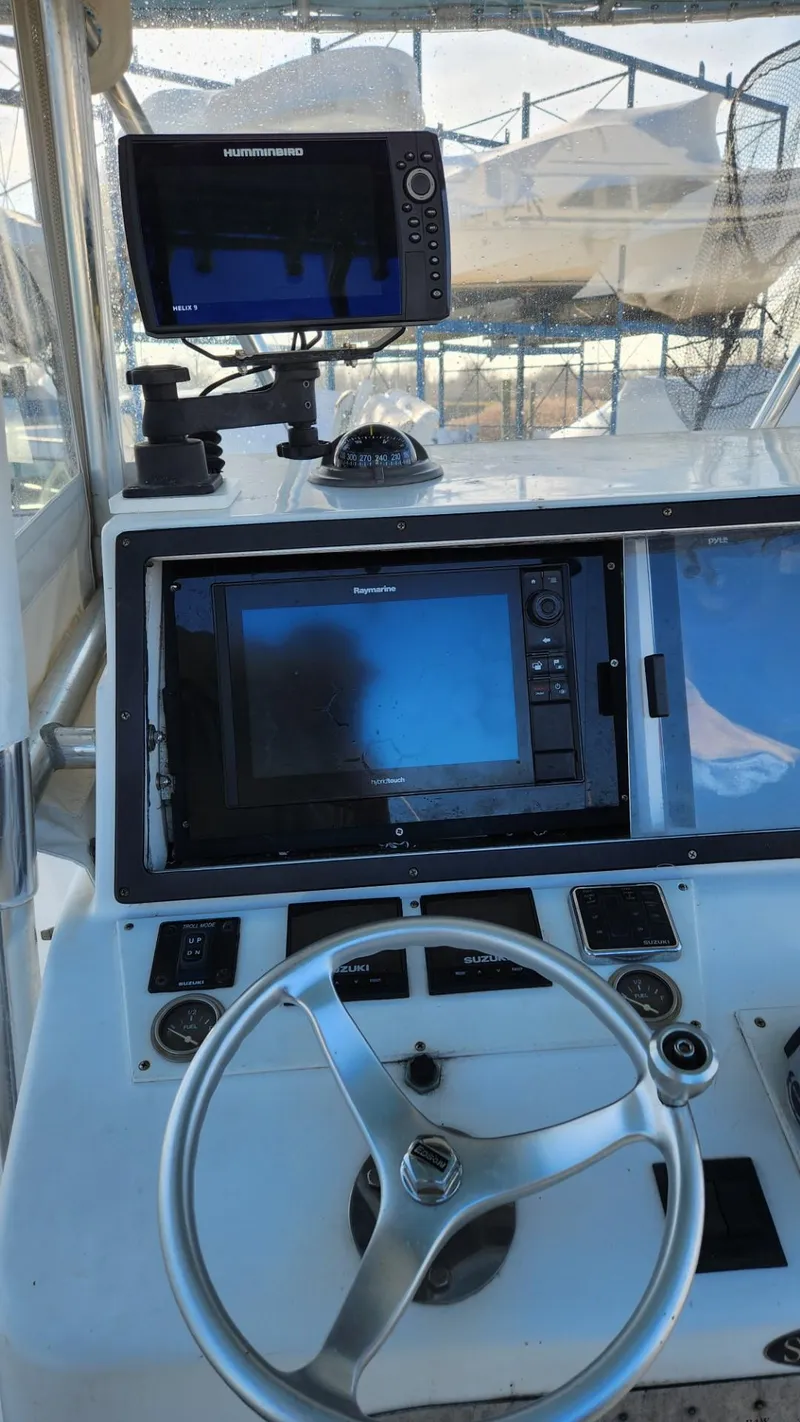 Slide: The Image of 2005 SeaCraft SC32 Master Angler boat dashboard with navigation equipment. - 23