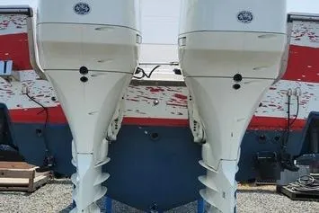 Slide: The Image of 2005 SeaCraft SC32 Master Angler boat with dual outboard motors, rear view. - 27