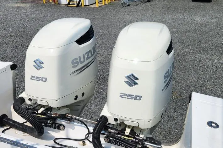 Slide: The Image of Twin Suzuki 250 outboard motors on a 2005 SeaCraft SC32 Master Angler boat. - 29