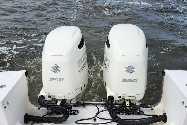 Slide: The Image of Twin Suzuki 250 outboard engines on a 2005 SeaCraft SC32 Master Angler boat. - 30
