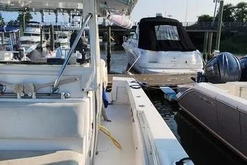 Slide: The Image of 2005 SeaCraft SC32 Master Angler docked at marina, surrounded by other boats. - 34