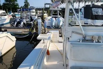 Slide: The Image of 2005 SeaCraft SC32 Master Angler docked with other boats at a marina. - 35