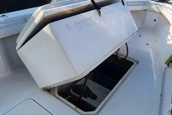 Slide: The Image of 2005 SeaCraft SC32 Master Angler boat with open storage compartment. - 38