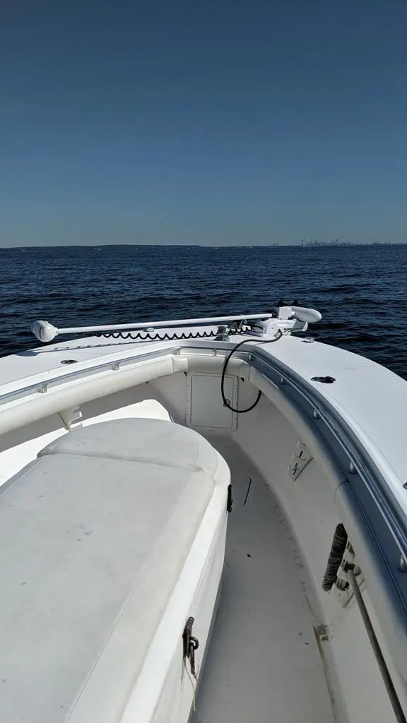 Slide: The Image of 2005 SeaCraft SC32 Master Angler boat on open water under clear sky. - 4