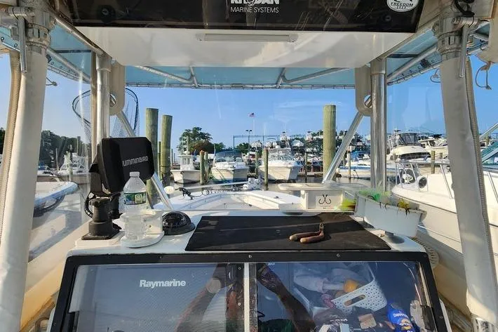 Slide: The Image of 2005 SeaCraft SC32 Master Angler boat docked at marina with fishing gear. - 42