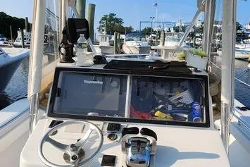 Slide: The Image of 2005 SeaCraft SC32 Master Angler boat dashboard with navigation equipment at marina. - 44