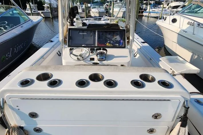 Slide: The Image of 2005 SeaCraft SC32 Master Angler boat interior with rod holders and control panel. - 46