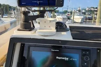 Slide: The Image of 2005 SeaCraft SC32 Master Angler dashboard with Raymarine navigation system at marina. - 48