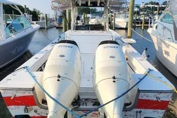 Slide: The Image of 2005 SeaCraft SC32 Master Angler boat docked with twin outboard engines. - 5