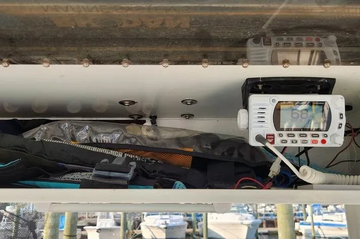 Slide: The Image of Storage compartment of a 2005 SeaCraft SC32 Master Angler with marine radio and gear. - 51
