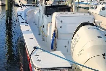 Slide: The Image of 2005 SeaCraft SC32 Master Angler boat docked with Suzuki engine. - 54