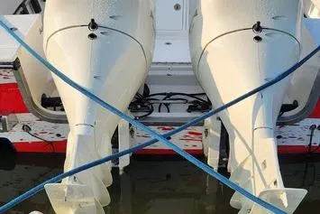 Slide: The Image of 2005 SeaCraft SC32 Master Angler with dual outboard motors, docked on water. - 55