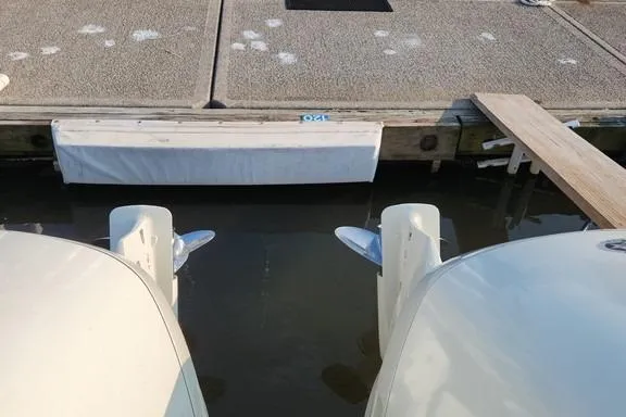 Slide: The Image of 2005 SeaCraft SC32 Master Angler boat engines docked at marina. - 59