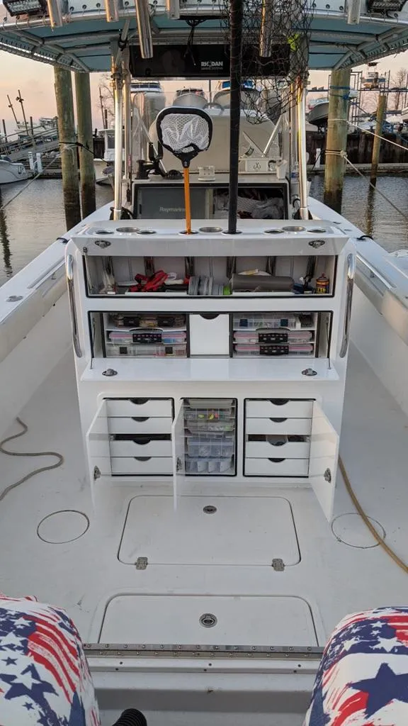 Slide: The Image of 2005 SeaCraft SC32 Master Angler boat with organized fishing gear storage. - 8