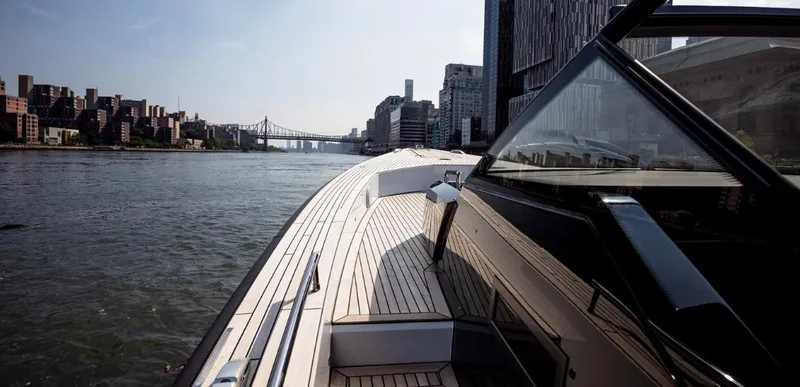 Slide: The Image of 2024 Windy SR52 yacht cruising near city skyline and bridge. - 7