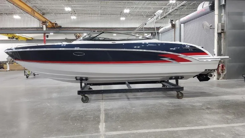 Slide: The Image of 2025 Formula 270 Bowrider boat in a warehouse. - 0