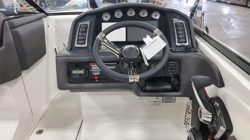 Slide: The Image of 2025 Formula 270 Bowrider dashboard with steering wheel and control panel. - 13