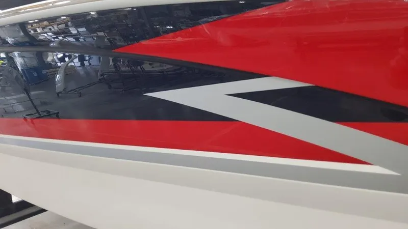 Slide: The Image of 2025 Formula 270 Bowrider boat with red, black, and white hull design. - 2