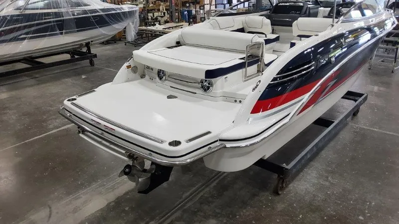 Slide: The Image of 2025 Formula 270 Bowrider boat in a showroom, rear view. - 3