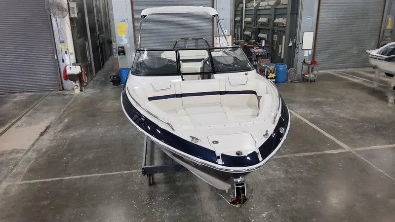 Slide: The Image of 2025 Formula 270 Bowrider boat in a storage facility. - 4