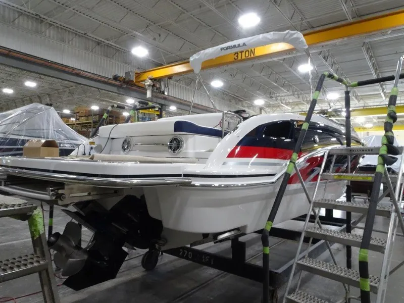 Slide: The Image of 2025 Formula 270 Bowrider boat in a manufacturing facility. - 5