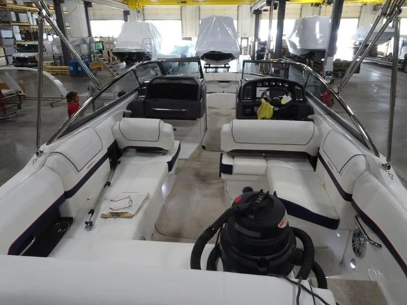 Slide: The Image of 2025 Formula 270 Bowrider interior view in a boat manufacturing facility. - 7