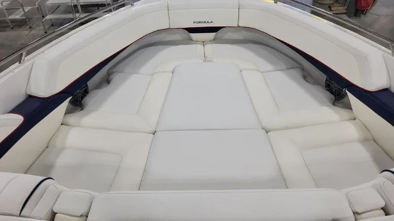 Slide: The Image of 2025 Formula 270 Bowrider with spacious white cushioned seating. - 8