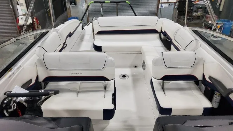 Slide: The Image of 2025 Formula 270 Bowrider interior with white and navy seating. - 9