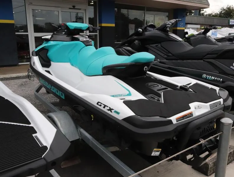 Slide: The Image of 2023 Sea-Doo GTX 130 PRO jet ski with turquoise seat on display. - 2