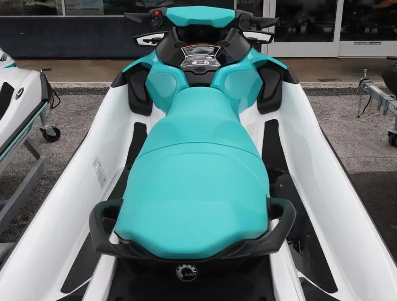 Slide: The Image of 2023 Sea-Doo GTX 130 PRO jet ski with turquoise seat and white body. - 4