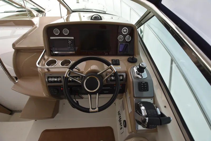 Slide: The Image of 2016 Formula 37 Cruiser helm with modern controls and navigation system. - 14