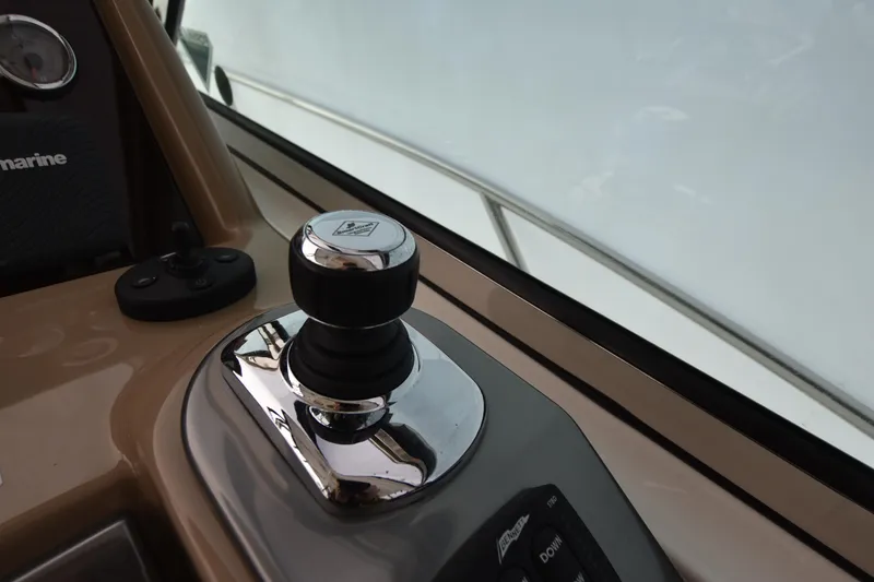 Slide: The Image of Joystick control on the helm of a 2016 Formula 37 Cruiser boat. - 15