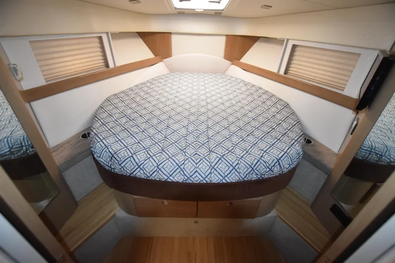 Slide: The Image of 2016 Formula 37 Cruiser cabin with a cozy bed and modern interior design. - 29