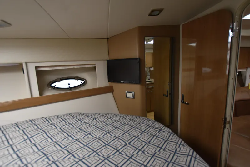Slide: The Image of Interior cabin of a 2016 Formula 37 Cruiser with bed, TV, and porthole. - 31