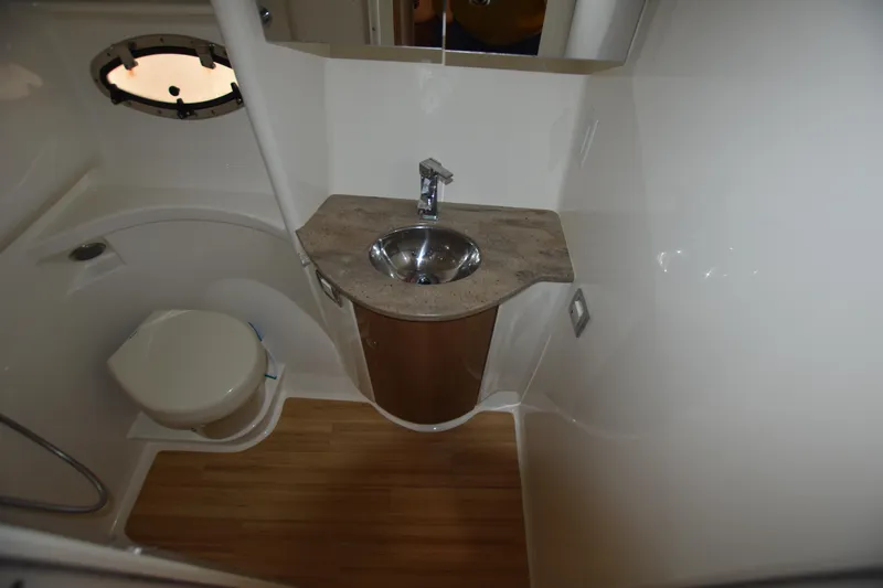Slide: The Image of 2016 Formula 37 Cruiser bathroom with sink, toilet, and wooden flooring. - 34