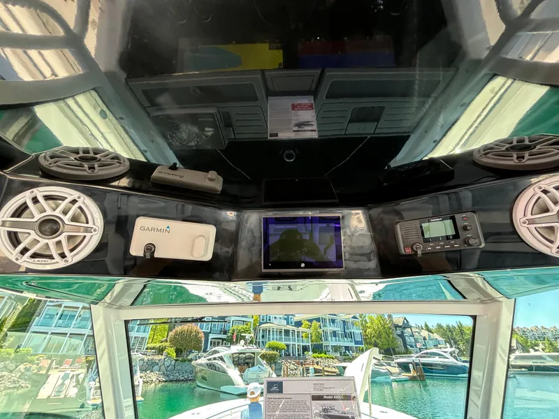 Slide: The Image of Blackfin 400 CC 2025 helm with Garmin electronics and waterfront view. - 14