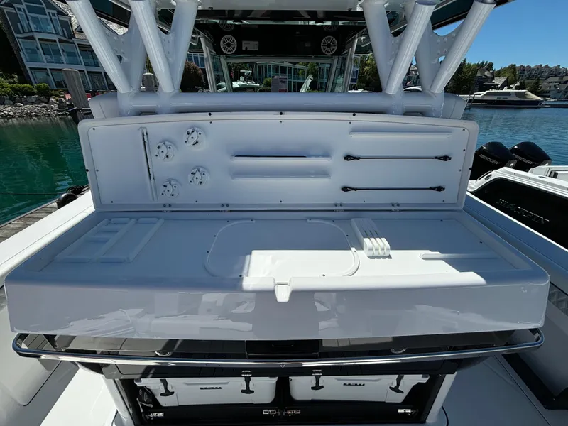 Slide: The Image of 2025 Blackfin 400 CC boat with a clean, white fishing station. - 17