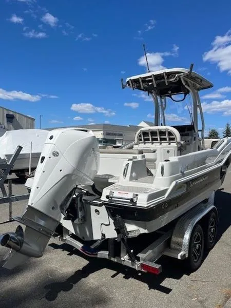 Slide: The Image of 2024 Finseeker 230 boat on trailer under clear blue sky. - 5