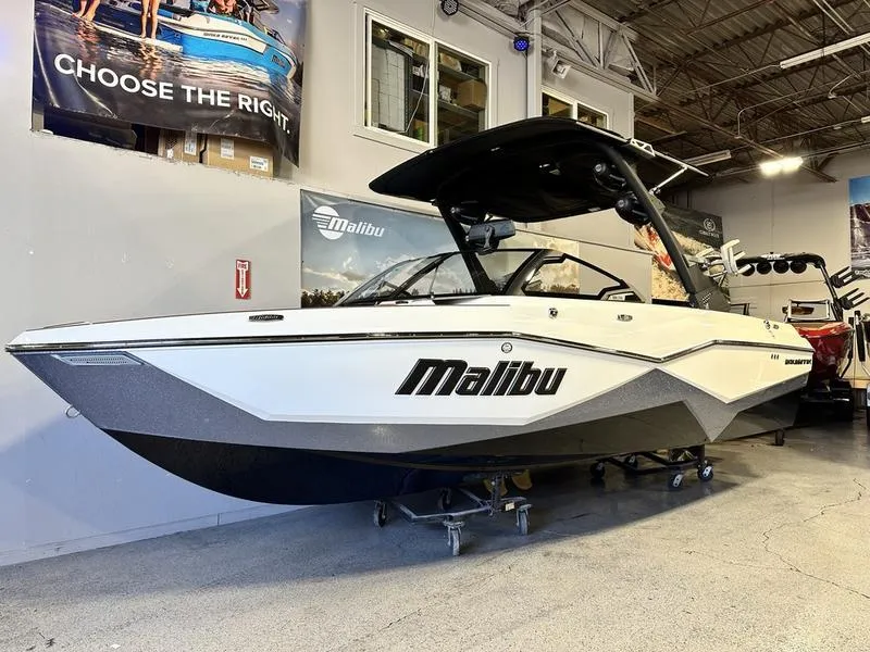 Slide: The Image of 2024 Malibu 22 LSV boat displayed indoors, showcasing sleek design and modern features. - 3