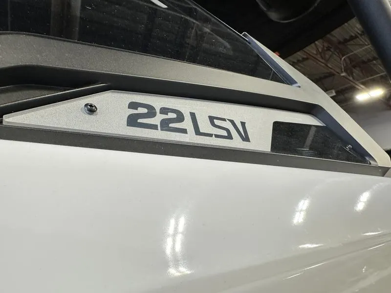 Slide: The Image of 2024 Malibu 22 LSV boat close-up, showcasing model name on the side. - 5