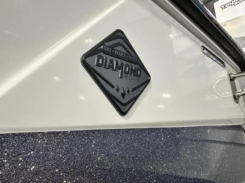 Slide: The Image of 2024 Malibu 22 LSV boat with Diamond Hull badge for ski, wake, and surf. - 6
