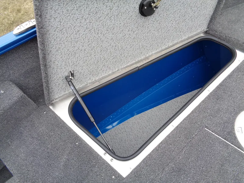 Slide: The Image of 2024 Lund 1775 Adventure SS boat storage compartment, open and empty. - 24