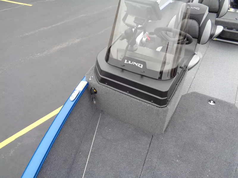 Slide: The Image of 2024 Lund 1775 Adventure SS boat interior with steering console and seating. - 25