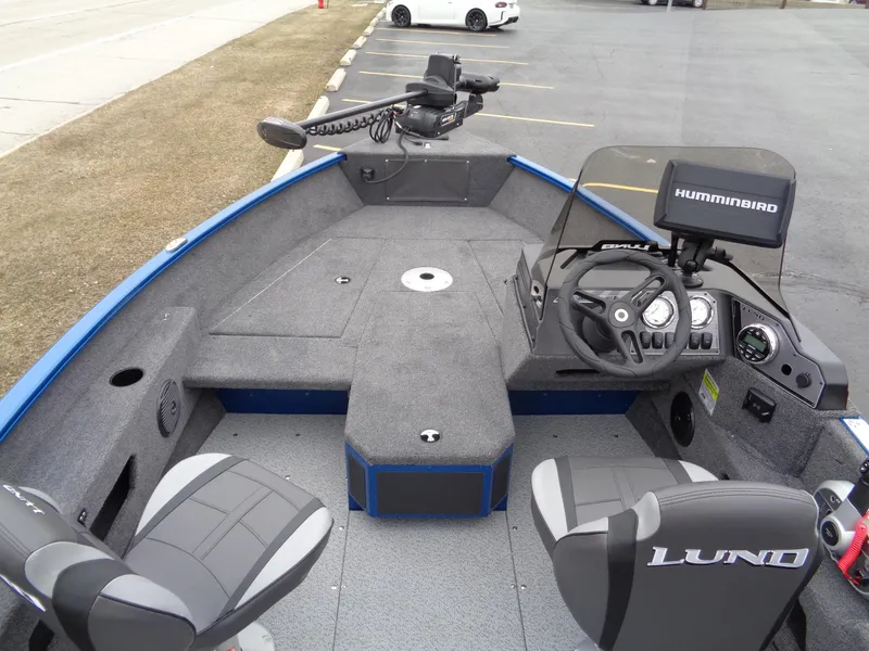 Slide: The Image of 2024 Lund 1775 Adventure SS fishing boat interior with steering console and seating. - 27