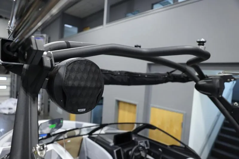 Slide: The Image of 2024 Malibu 23 LSV boat interior with speaker and control panel. - 12