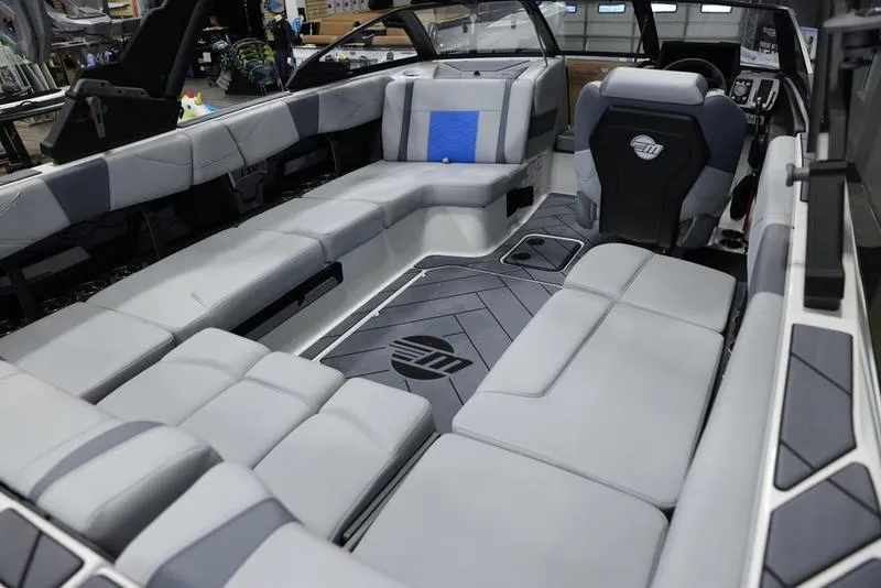 Slide: The Image of 2024 Malibu 23 LSV boat interior with luxurious seating and modern design. - 14