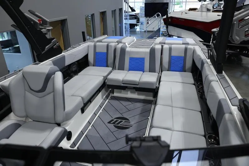 Slide: The Image of 2024 Malibu 23 LSV boat interior with spacious seating and modern design. - 21