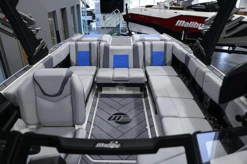 Slide: The Image of 2024 Malibu 23 LSV boat interior with luxurious seating and modern design. - 22