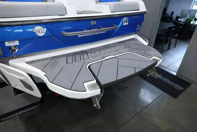 Slide: The Image of 2024 Malibu 23 LSV boat swim platform with non-slip surface. - 7