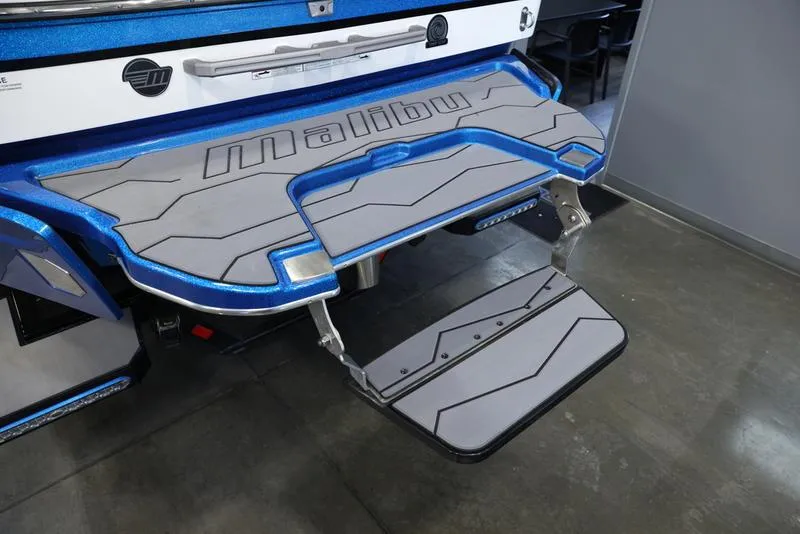 Slide: The Image of 2024 Malibu 23 MXZ boat swim platform with fold-down step. - 14